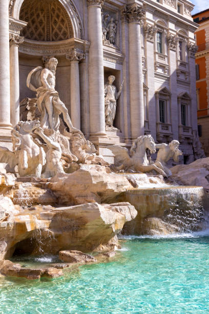 famous trevi fountain in rome with flowing water, Italy
